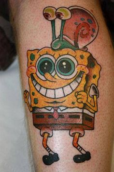 a cartoon character tattoo on the leg