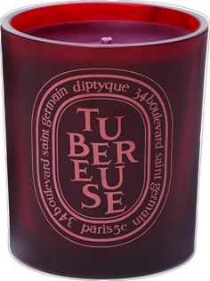 a red candle with the words tu beu sef in white lettering on it