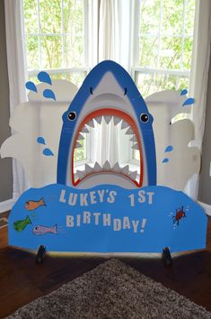 a birthday cake shaped like a shark with its mouth open