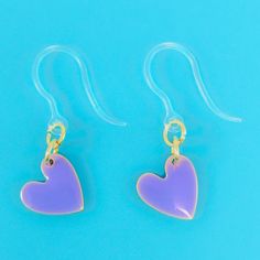 Love at first sight! Our Paint Drop Heart Earrings (Dangles) were designed with sensitive ears in mind – made with hypoallergenic plastic hooks and enough love to make your heart flutter. Fling 'em on for a look that's almost too precious for words! Earring length: 28mm Valentine's Day Hypoallergenic Adjustable Heart Earrings, Trendy Purple Heart Earrings As Gift, Trendy Purple Heart Earrings For Gift, Hypoallergenic Heart Drop Earrings For Gift, Cute Purple Jewelry With Heart Charm, Hypoallergenic Heart-shaped Trendy Earrings, Trendy Double Heart Hypoallergenic Earrings, Hypoallergenic Heart Drop Earrings, Trendy Hypoallergenic Heart Drop Earrings