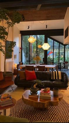 a living room filled with furniture and lots of windows