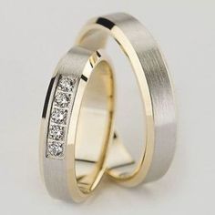 two gold wedding bands with diamonds on each one, set in yellow and white gold