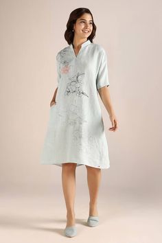 Ice blue dress with hand drawn floral doodles, thread applique embroidery in floral work and textured pattern. - Aza Fashions V-neck Linen Dress With Floral Print, Embroidered Linen Midi Dress For Spring, Spring Embroidered Linen Midi Dress, Linen V-neck Dress With Floral Embroidery, Floral Embroidery Linen V-neck Dress, V-neck Linen Dress With Floral Embroidery, Blue Linen Dress With Floral Print, Elegant Linen Dress With Floral Embroidery, Spring Linen Dress With Embroidered Hem