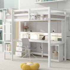 a white loft bed with desk underneath it