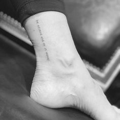 a person's foot with a small tattoo on the ankle that says, i love you