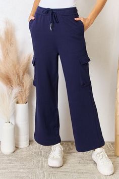 💥 Elevate your style with our RISEN Drawstring Relaxed Cargo Wide Leg Pants! 💰 On sale for only $47.95, these pants are a steal! 😍 Featuring a comfortable drawstring waist and trendy cargo pockets, these pants are perfect for any occasion. 🌟 Get yours now! #RISEN #CargoPants #WideLeg #Drawstring #RelaxedFit #Fashion #Comfortable #Trendy #OnSale Cargo Wide Leg Pants, Pant Trends, Activewear Sets, Leg Design, Loungewear Set, Plaid Tops, Black And White Colour, Basic Style, Shirt Accessories