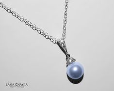 Wedding Swarovski 8mm Light Blue Pearl Drop Pendant with .925 Sterling Silver Chain Bridal Necklace. CHAIN is 18 inches (45.7cm) long. PENDANT is about 0.75 inch (2cm) long including bail. Elegant and timeless, this dainty necklace is perfect for weddings or special occasions such as birthdays, anniversaries, graduations, proms...or whatever you can imagine! Handmade necklace, is with .925 Sterling Silver 18 inches cable chain, Swarovski 8mm Light Blue round crystal pearl, Rhodium Sterling Silve Elegant Light Blue Jewelry For Gift, Elegant Light Blue Round Pendant Necklace, Sapphire Round Pendant Jewelry For Wedding, Sapphire Round Pendant For Wedding, Elegant Light Blue Necklaces For Gifts, Elegant Light Blue Necklace For Anniversary, Blue Round Pendant Jewelry For Wedding, Blue Pearl Pendant Jewelry, Blue Pendant Jewelry With Pearl