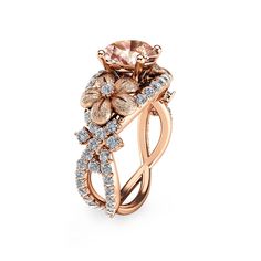 a ring with flowers and diamonds on the side, set in 18k rose gold