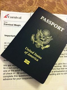 a black passport sitting on top of a table