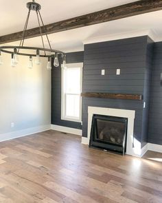 empty living room with wood floor and fireplace