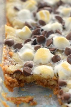 chocolate chip cookie bars with marshmallows and chocolate chips on top are ready to be eaten