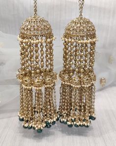 pair of gold and red beaded chandelier earrings