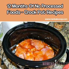 a crock pot filled with meat sitting on top of a counter