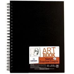 a black notebook with an orange sticker on it