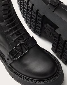 Valentino Garavani combat boot in calfskin with VLogo Signature decoration - Strap with custom VLogo Signature buckle in tone-on-tone finish - Inner side zip - Custom welt with embossed VLogo Signature motif - Rubber lug sole - Heel height: 45 mm / 1.8 in. with 25 mm / 1 in. platform - Shaft height: 15 cm / 6 in. in an Italian size 37 - Made in Italy Luxury Calf Leather Lace-up Boots With Lug Sole, Luxury Lace-up Boots With Lug Sole In Calf Leather, Luxury Ankle Combat Boots With Lug Sole, Luxury Ankle Lace-up Boots With Lug Sole, Luxury Lace-up Ankle Boots With Lug Sole, Luxury Ankle Moto Boots With Lug Sole, Luxury Platform Boots With Lug Sole, Luxury Calf Leather Boots With Lug Sole, Luxury Calf Leather Platform Boots With Leather Sole