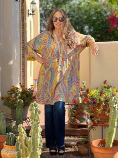 Feel like a princess when you wear our Saffron Principessa Paisley Italian silk tunic! Principessa in Italian means princess and is pronounced prin-chee-pessa, The rich saffron colour in this print sets off a magical multicolour mix of blues, reds, and oranges that swirl around in the detailed paisley motifs to make for a truly exciting combination of colours. Wear this tunics on it's own or throw it over your favourite pair of pants! This tunic is guaranteed to make everyone smile, mostly she w Festive Long Sleeve Paisley Print Kurta, Long Sleeve Paisley Print Kurta For Festive Occasions, Festive Long Sleeve Kurta With Paisley Print, Bohemian Long Sleeve Silk Tunic, Yellow Bohemian Long Sleeve Kurta, Yellow Long Sleeve Bohemian Kurta, Bohemian Silk V-neck Kurta, Festive Bohemian Kurta With Paisley Print, Festive Bohemian Yellow Blouse