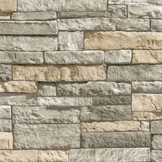 a stone wall that looks like it is made out of different types of stones