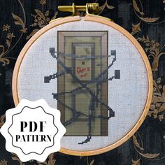 the cross stitch pattern has been made to look like a door