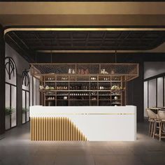 the interior of a restaurant with tables, chairs and shelves filled with bottles on display