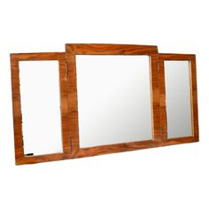 three wooden mirrors are shown against a white background