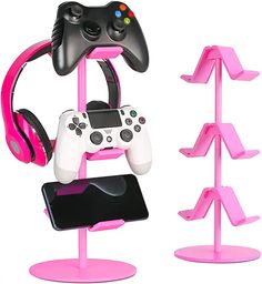 a pink and black game controller on a stand