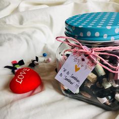 a jar filled with lots of different types of candies