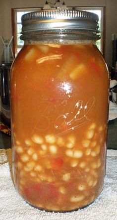 a jar filled with food sitting on top of a table