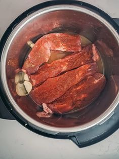 the meat is being cooked in the pot on the stove top and ready to be cooked