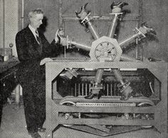 a man standing next to an old fashioned machine