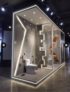 a modern bathroom is displayed in the shape of a hexagonal structure with lights