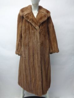 "BEAUTIFUL & VERY STYLISH PASTEL MINK FUR COAT FOR WOMEN! THE COLLAR TYPE IS \"NOTCH\", IT CLOSES WITH FRONT HOOK & EYE CLOSURES AND HAS TWO SIDE POCKETS. THIS ITEM IS PRE-OWNED:THE FUR AND THE INSIDE LINING ARE \"MINT\", THE SECOND BEST CONDITION POSSIBLE! AFTER BUYING THIS ITEM, IT WOULD BE VERY MUCH APPRECIATED IF YOU COULD PROVIDE YOUR HEIGHT, WEIGHT AND BUST CIRCUMFERENCE, SO WE CAN ADJUST THE COAT TO YOUR SIZE, BEFORE SHIPPING, IF NEEDED. IT WILL ALSO HELP US TO SHIP YOUR ITEM SOONER, THAN Classic Formal Fur Coat For Fall, Classic Mink-colored Formal Outerwear, Classic Mink Color Formal Outerwear, Brown Full-length Outerwear For Fall, Long Sleeve Fur Coat For Spring Formal Occasions, Formal Long Sleeve Fur Coat For Spring, Spring Formal Long Sleeve Fur Coat, Formal Spring Long Sleeve Fur Coat, Classic Fitted Long Sleeve Fur Coat