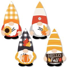 four gnomes with fall decorations on their heads