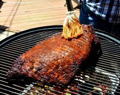 a piece of meat is being grilled on the grill