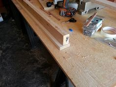 the table is being worked on with woodworking tools and other things to make it look like they are working on something