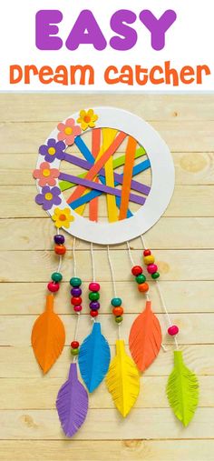 an easy paper plate dream catcher with colorful feathers and beads