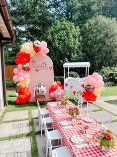 an outdoor table set up for a valentine's day party