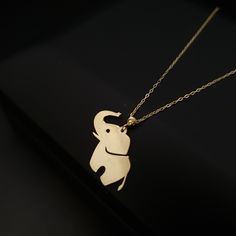 14K Real Gold Baby Elephant Necklace weight: 1.00 gr approximate length: 45.5cm - 18inch PRODUCT CARE * Remove your jewelry before exercising, showering and sleeping. * Avoid exposure to perfumes, lotions and other chemicals. BEST PRICE ON ETSY FOR SOLID 18kGOLD NECKLACES! Premium spring lobster Hook for added safety! Priced to sell! Compare our prices to other similar sellers! Arrives in a GIFT BOX and includes FREE SHIPPING within the USA and Canada. International shipping is available at the most economical rates on ETSY. I HAVE BEEN IN THE JEWELRY BUSINESS ALL MY LIFE. I am a second -generation family member making gold and jewelry. Please feel free to ask me any questions - Always happy to help! We are Shipping with the Best WORLD WIDE SHIPPING COMPANY DHL With INSURANCE Fast Replies Yellow Gold Necklaces With Charms For Birthday Gift, Handmade Yellow Gold Necklaces For Birthdays, Handmade Yellow Gold Jewelry For Birthday, Handmade 14k Gold Jewelry For Birthday, Mothers Birthday Gift, Mothers Birthday, Baby Elefant, Animal Pendant, Elephant Necklace