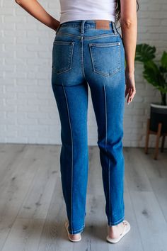 Effortlessly step up your denim game with our Campbell High Rise Seam Detail Straight Jeans from Judy Blue. Featuring a flattering high rise fit and a classic dark wash, these jeans also include center front and back seam details for an added touch of style. The straight leg silhouette is versatile and can be worn with an optional cuffed hem for a chic look. Plus, our non-distressed denim ensures a polished appearance. Upgrade your wardrobe with these timeless jeans that offer both fashion and c Timeless Jeans, Judy Blue Jeans, Dress Romper, Skirt Pants, Distressed Denim, Step Up, Straight Jeans, Jumpsuit Dress, Dress Skirt