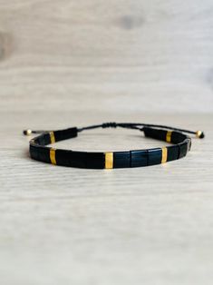 Black Heishi Beads Bracelet As Gift, Adjustable Black Rectangular Beaded Bracelets, Black And Gold Bracelet, Bracelet Miyuki, Miyuki Bracelet, Square Beads, Cord Jewelry, Chic Gifts, Mens Beaded Bracelets