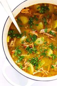 a white bowl filled with soup on top of a table