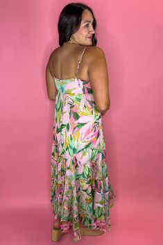 Gorgeous tropical maxi dress with a sparkle metallic look to it! Zipper in the back Lined FIT: True to size but no stretch! So size up if in between sizes. Model is a size 8, 36DD wearing a large. 100% Polyester Flowy Tropical Print Maxi Dress, Tropical Maxi Dress For Spring, Tropical Style Spring Maxi Dress, Flowy Maxi Dress With Tropical Print, Tropical Flowy Maxi Dress, Flowy Tropical Print Maxi Sundress, Flowy Tropical Print Sundress Maxi Dress, Sleeveless Tropical Print Maxi Dress For Party, Tropical Maxi Dress For Party