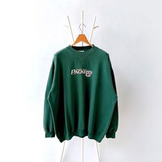 90s Green Bay Packers NFL sweatshirt/ XL * PLEASE READ BEFORE PURCHASE * PLEASE consider the PHOTOS before making the decision * The images may DIFFER in appearance from the actual product because we took pictures under daylight.  * PLEASE send your PHONE NUMBER after your purchase for the shipping company to contact you X No returns X No refund Condition : 8/10 More details : look at the pictures  Brand : NFL Size : XL Pit to pit/ Chests : 28.5/57 inches  Length : 30.5 inches  Material : cotton Polyester  Color : green  * ALL ITEMS are VINTAGE which may show some signs of wear and tear * Due to the different display and different light, the picture may not reflect the actual color of the item * Please, remember that our items are vintage so they may show some signs of wear, tear and yello Nfl Sweatshirt, Nfl Packers, Shipping Company, Green Bay Packers, Green Bay, Phone Number, Sweat Shirt, Nfl, Gender Neutral