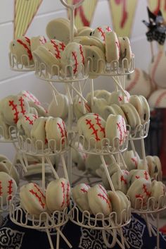 baseball themed desserts are displayed on sticks