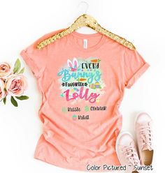 a t - shirt with the words every bunny loves mama on it next to some flowers