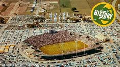 an aerial view of a football stadium with many cars parked in it and the words history on top