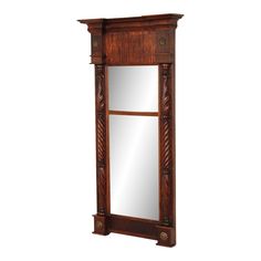 a wooden mirror cabinet with an ornate design on the top and bottom, in front of a white background