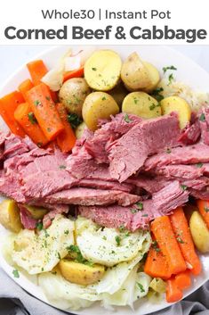 corned beef with potatoes and carrots on a plate