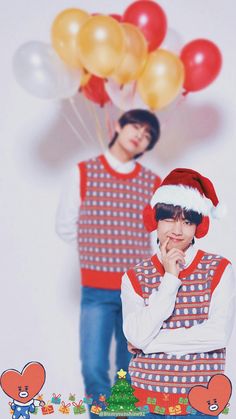 two young men standing next to each other in front of balloons