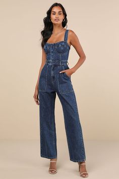 This spring will be full of admirers and compliments with a trendy look like the Lulus Fresh Perfection Dark Wash Bustier Sleeveless Denim Jumpsuit! Slightly acid-washed 100% cotton denim shapes this too-cool jumpsuit that features a bustier-inspired bodice with seamed cups and a sweetheart neckline, supported by wide adjustable tank straps. A hidden snap button placket secures the front of the bodice, atop a banded waist with convenient belt loops and a hidden zip fly. The relaxed, straight pant legs feature front porkchop pockets and back patch pockets, all before finishing at full-length hems. Smocked panel at back for fit. Fit: This garment fits true to size. Length: Floor length. Size medium measures 50.5" from top to bottom. Inseam: 28.75 Front Rise: 11.50 Bust: Great for any cup siz Full Denim Outfit, Bustier Jumpsuit, Jumpsuit Denim, Denim Bustier, Short Torso, Long Torso, Gameday Outfit, Relaxed Fit Jeans, Guest Outfit