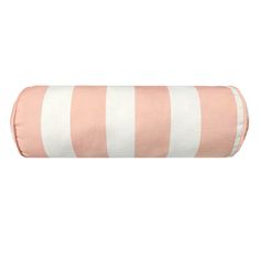 a pink and white striped pillow on a white background